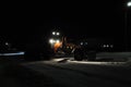 Snow truck silhouette working night cleaning city road