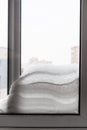 snow between two window glasses in winter Royalty Free Stock Photo