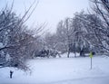 Suburban street covered in snow after a blizzard in winter Royalty Free Stock Photo