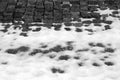 Snow on urban pavement in black and white Royalty Free Stock Photo