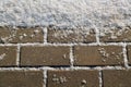 Snow on urban pavement Royalty Free Stock Photo