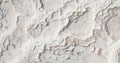 Snow white abstract mineral water blurred calcium formed texture of travertines of Pamukkale cliff surface in Turkey. Royalty Free Stock Photo