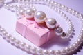 Luxurious pearl jewelry on a pink box. Snow-white pearls. Bijouterie. Jewelry. Snow-white beads on a white background. Brilliant p Royalty Free Stock Photo