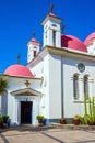 Snow-white church building with pink domes Royalty Free Stock Photo