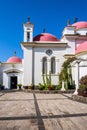 Snow-white church with pink domes Royalty Free Stock Photo