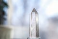 Snow white crystal of pure transparent quartz. Chalcedony gem on blurred background Royalty Free Stock Photo