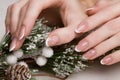 Snow White manicure on female hands. Winter nail design. Royalty Free Stock Photo