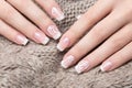 Snow White manicure on female hands. Winter nail design. Royalty Free Stock Photo