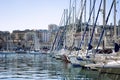 Snow-white sailing yachts in a marina in Marseille on a bright sunny day. Beautiful view Royalty Free Stock Photo