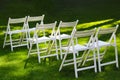 Snow-white wooden chairs for guests at an outdoor wedding ceremony Royalty Free Stock Photo