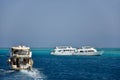 Snow-white yachts with vacationing tourists on board in Red Sea. Beautiful seascape. Vacation,