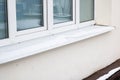 Snow on windowsill of window from outside