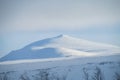 Snow winter in the mountains beyond Northern polar circle