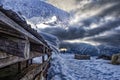 Snow on a wood depot in the italian alps in a winter day Royalty Free Stock Photo
