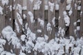 Snow wooden fence closeup winter outdoors Royalty Free Stock Photo