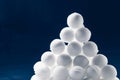 Snowballs heap on dark blue background