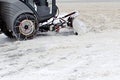 Snowblower on footpath in the city