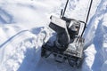 Snowblower at work on a winter day. Snowplow removing snow afterSnowblower at work on a winter day. Snowplow removing snow after b