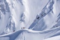 Snowboard freeride, snowboarders and tracks on a mountain slope. Extreme sport.