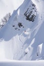 Snowboard freeride, snowboarders and tracks on a mountain slope. Extreme sport.