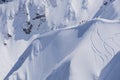 Snowboard freeride, snowboarders and tracks on a mountain slope. Extreme winter sport.