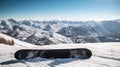 Snowboard is lying on snowy mountain, with sun shining behind it. The board appears to be positioned in front of some trees and Royalty Free Stock Photo