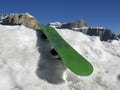 Snowboard resting in Dolomities