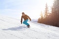 Snowboard winter activity, snowboarder going downhill