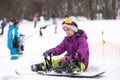 Snowboard winter sport. Cute girl with snowboard going to slide in winter nature Royalty Free Stock Photo