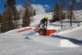 Snowboarder in Action: Jumping in the Mountain Snowpark Royalty Free Stock Photo