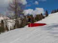 Snowboarder in Action: Jumping in the Mountain Snowpark Royalty Free Stock Photo