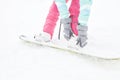 Snowboarder adjusting bindings Royalty Free Stock Photo