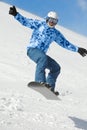 Snowboarder balances when flies on snowboard