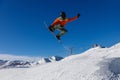 Snowboarder does a jumping trick in the snow Park