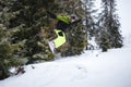 Snowboarder does the trick on the kicker
