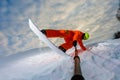 Snowboarder doing a trick and making a selfie Royalty Free Stock Photo