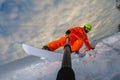 Snowboarder doing a trick and making a selfie Royalty Free Stock Photo