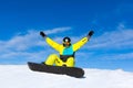 Snowboarder excited happy raised arms hands up