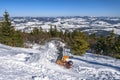 Snowboarder fallen down after jumping from snow hill. Mountain freeride snowboarding. Winter mountains Royalty Free Stock Photo