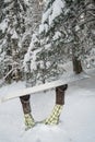 Snowboarder falling into the snow.