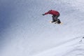 Snowboarder flying on the background of snowy slope. Extreme winter sports, snowboarding.