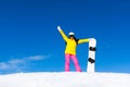 Snowboarder girl raised arms standing hold Royalty Free Stock Photo