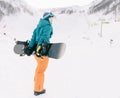 Snowboarder girl on ski resort. Royalty Free Stock Photo