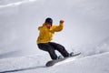 Snowboarder going down the slope at ski resort Royalty Free Stock Photo