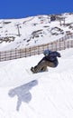 Snowboarder on half pipe of Pradollano ski resort in Spain