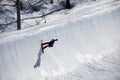 Snowboarder on half pipe trail