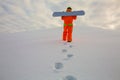 Snowboarder climbing on the top of ski slope Royalty Free Stock Photo