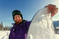 Snowboarder hold snowboard