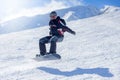 Snowboarder at jump inhigh mountains Royalty Free Stock Photo