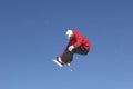 Snowboarder Jumping Against Blue Sky Royalty Free Stock Photo